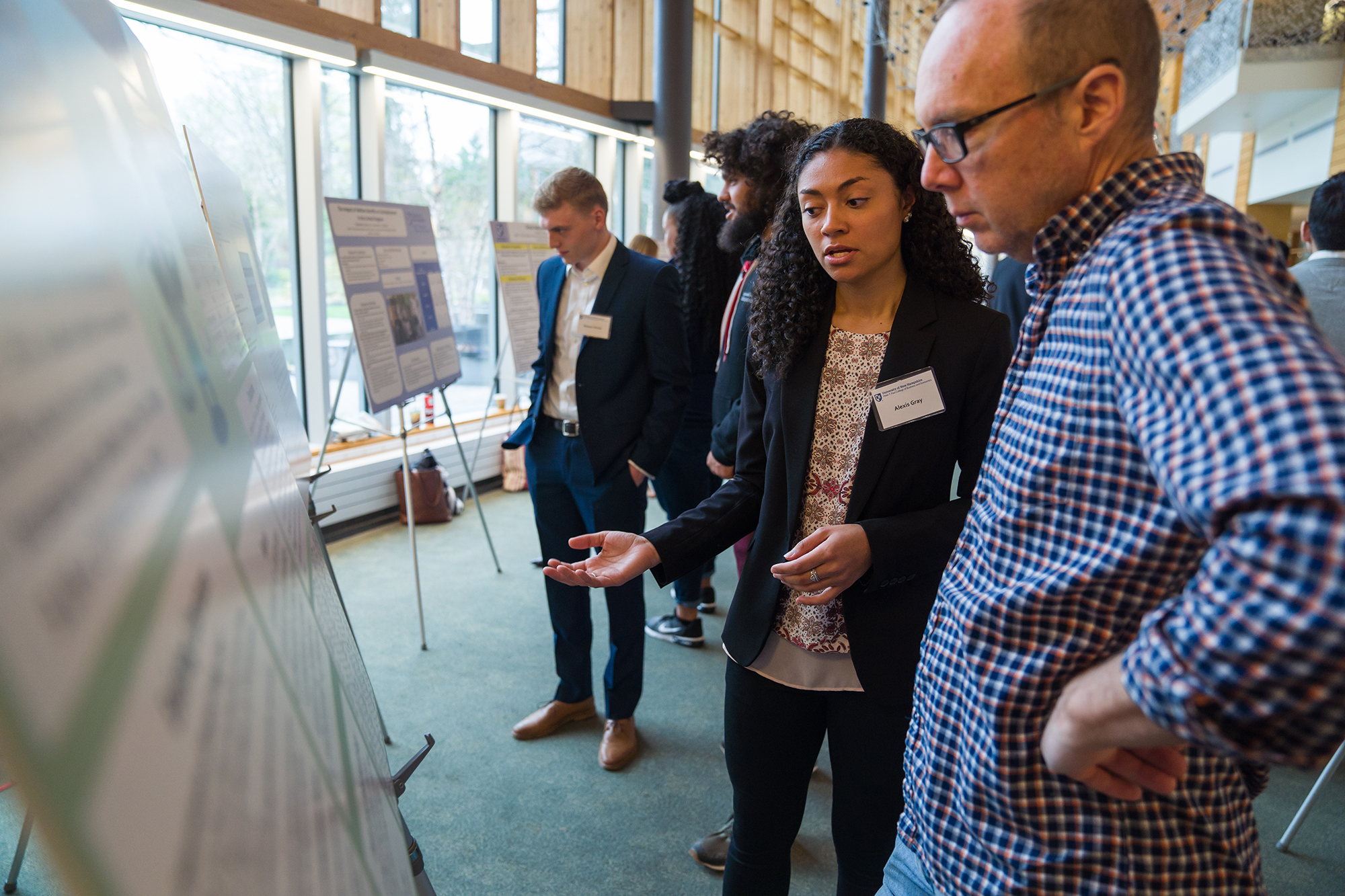 A student presents a research project at the college's undergraduate research conference