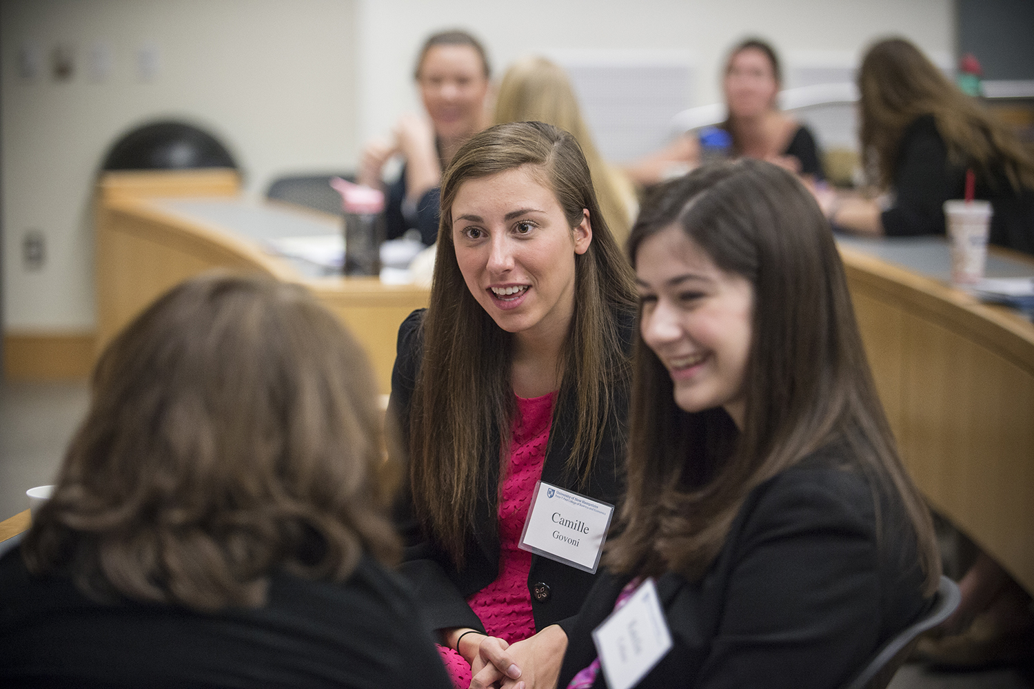 Students chat during a women in business club meeting