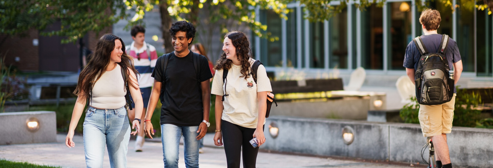 paul college students walking in front of the building