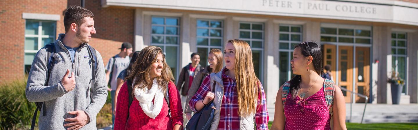 students walking in front of Paul College