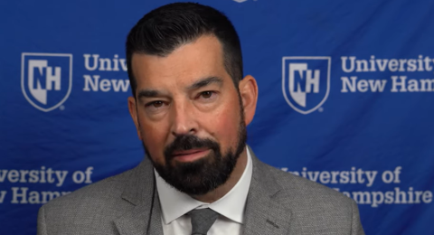 Ryan Day sitting for an interview at UNH.