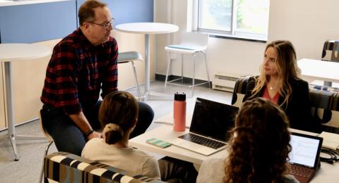 Business in Practice instructor with students in "The Forge"