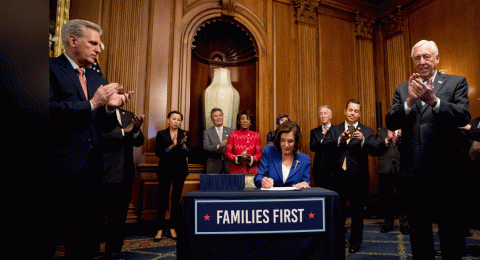 House Speaker Nancy Pelosi of Calif. signs the Coronavirus Aid, Relief, and Economic Security (CARES) Act (AP Photo_Andrew Harnik)