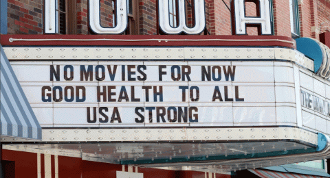 This Wednesday, April 1, 2020 file photo shows the marquee for the Iowa Theater, closed in response to the COVID-19 coronavirus outbreak, on John Wayne Drive in Winterset, Iowa. (AP Photo/Charlie Neibergall)