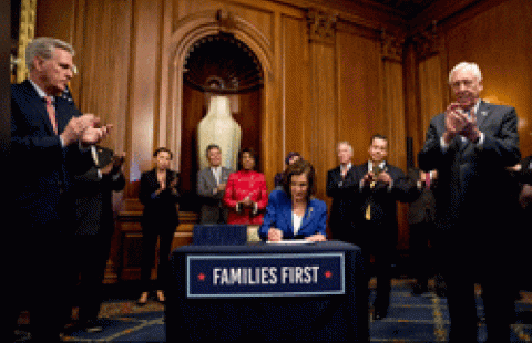 House Speaker Nancy Pelosi of Calif. signs the Coronavirus Aid, Relief, and Economic Security (CARES) Act (AP Photo_Andrew Harnik)