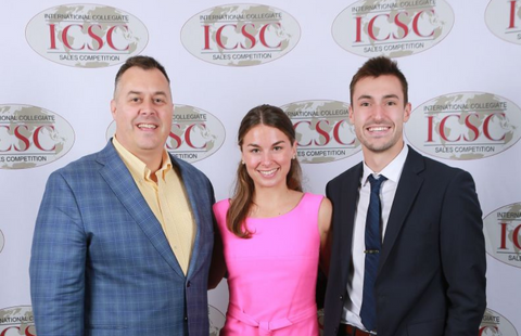 James McIlroy poses with two Paul College students at ICSC