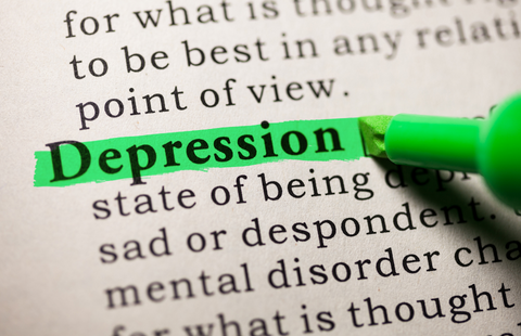 Photo of the word "depression" highlighted in dictionary