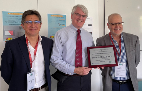 Dr. Michael (center) hold his 2023 RIFC | ISoF Eminent Franchising Scholar Award plaque next to Dr. Aliouche at the International Society of Franchising (ISoF) Conference