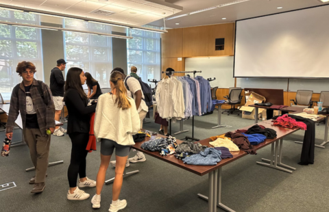 Students look around at Dress for Success: Career Closet at Paul College.