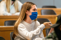 female student with mask in class