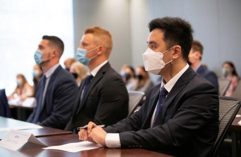 Kang Woo studying in his MBA class