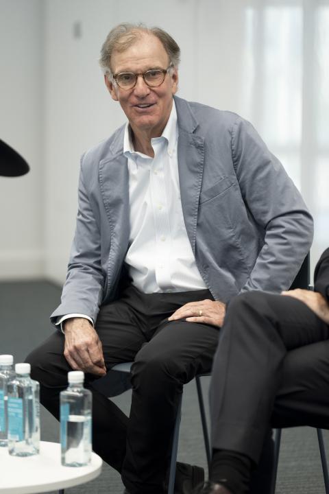 Thomas Gruen sits and speaks during a panel discussion.