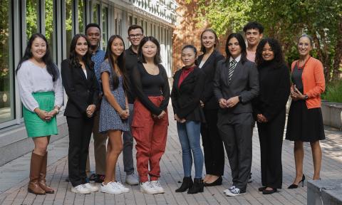 A group photo of the second full cohort of inclusive leadership fellows out in the Paul College Courtyard.