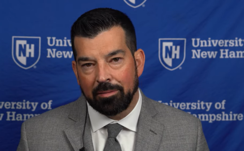 Ryan Day sitting for an interview at UNH.