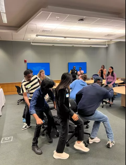 Students playing musical chairs at Grad Student mixer.