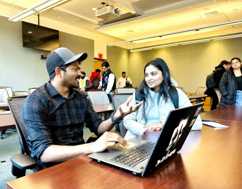 nagateja reddy, a graduate student, speaking with a classmate in class