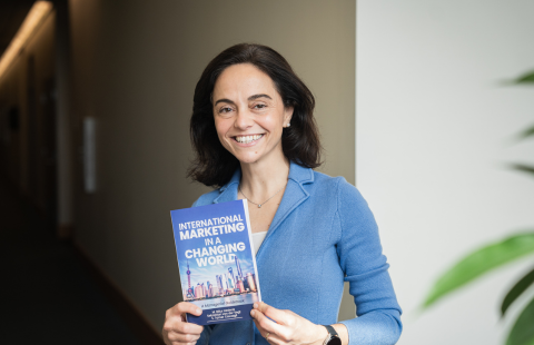 Billur Akdeniz poses at Paul College with her new book, “International Marketing in a Changing World: A Managerial Guidebook.” 