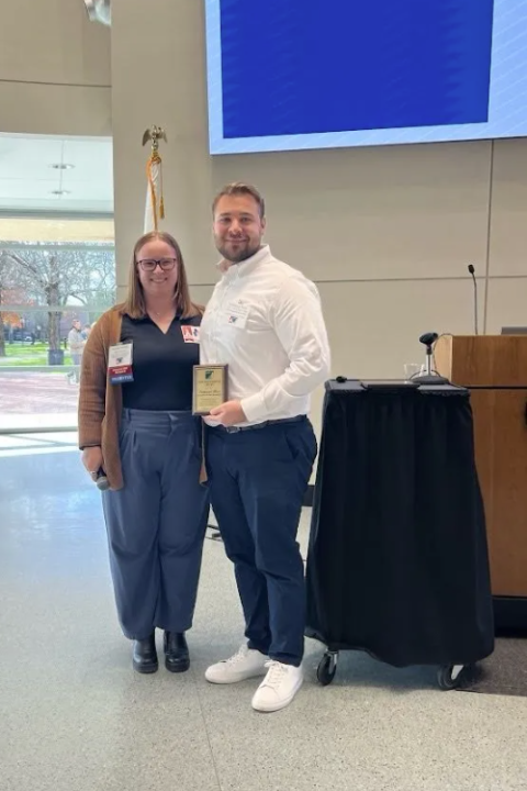Nathaniel Hunt holds his award.