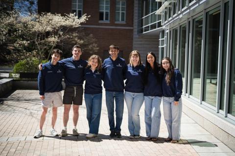 Paul College intern team standing in front of Paul College at UNH