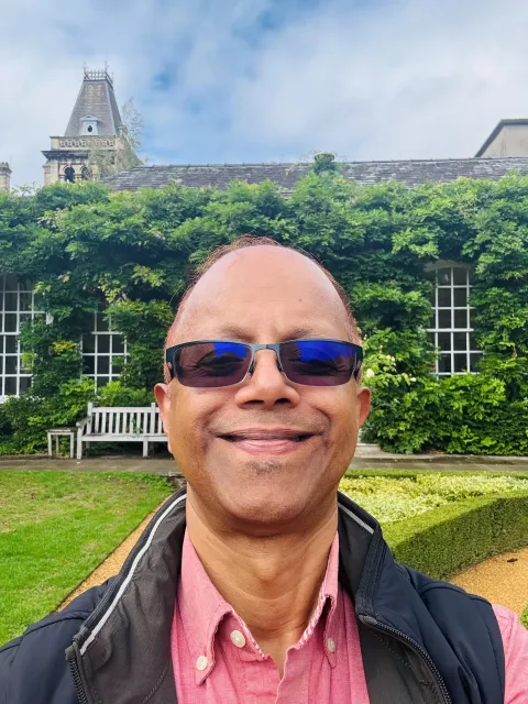 Dev Dutta outside selfie with sunglasses.