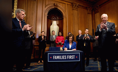 House Speaker Nancy Pelosi of Calif. signs the Coronavirus Aid, Relief, and Economic Security (CARES) Act (AP Photo_Andrew Harnik)