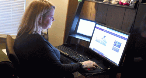Jennifer Cardoza, working at home for her job in the marketing department at John Hancock Investment, Sunday March 29, 2020, in Somerville. (Jim Michaud/MediaNews Group/Boston Herald)