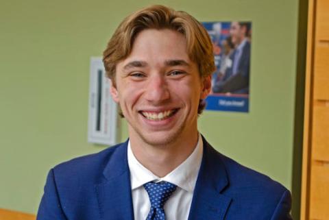 Kevin Murphy '20 A male student wearing business attire smiles at the camera.