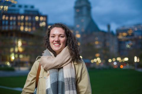 Jill Howard stands in Boston cityscape at night